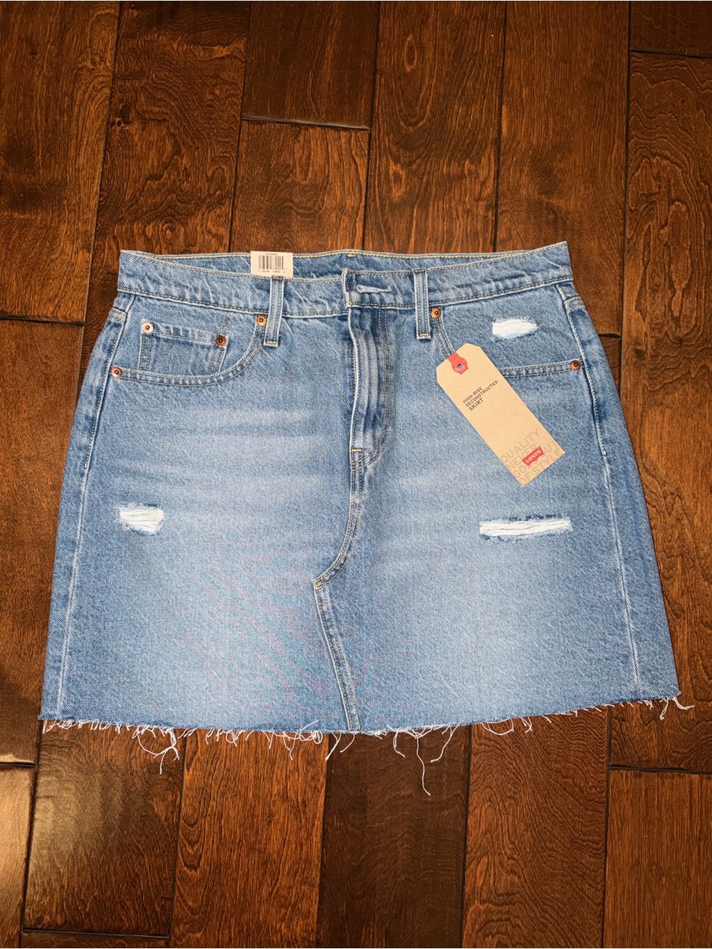 Levi's Light Blue Distressed Denim Mini Skirt with Frayed Hem